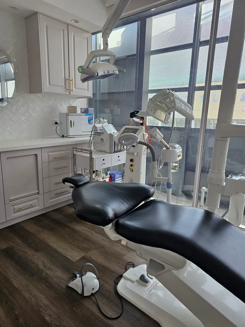 A treatment room at the clinic, with a professional treatment chair and equipment.