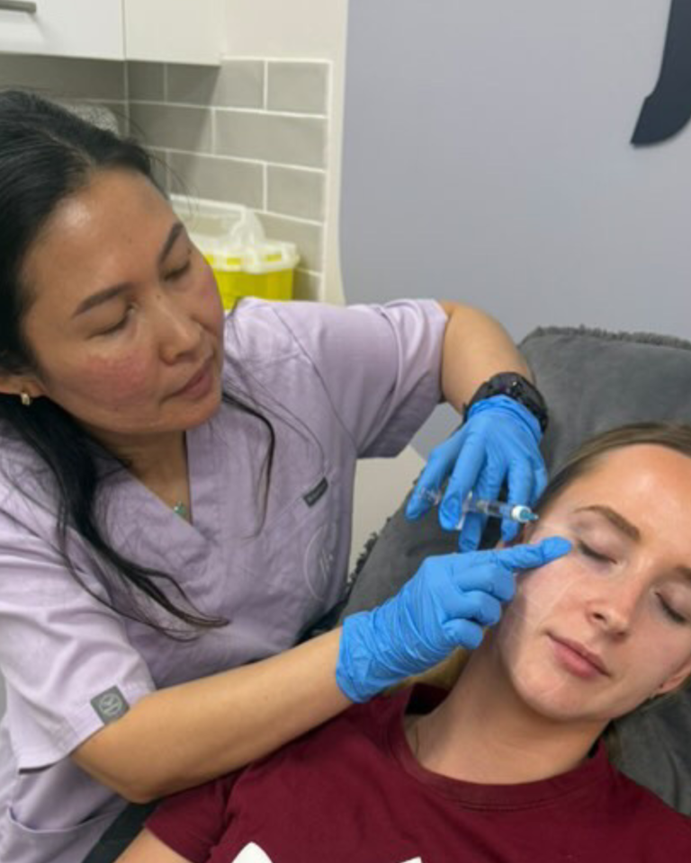 Precilla Sharp, RN, performing a precise facial injectable treatment on a client at The Contour Hub, a premier Cosmetic Clinic in Sydney