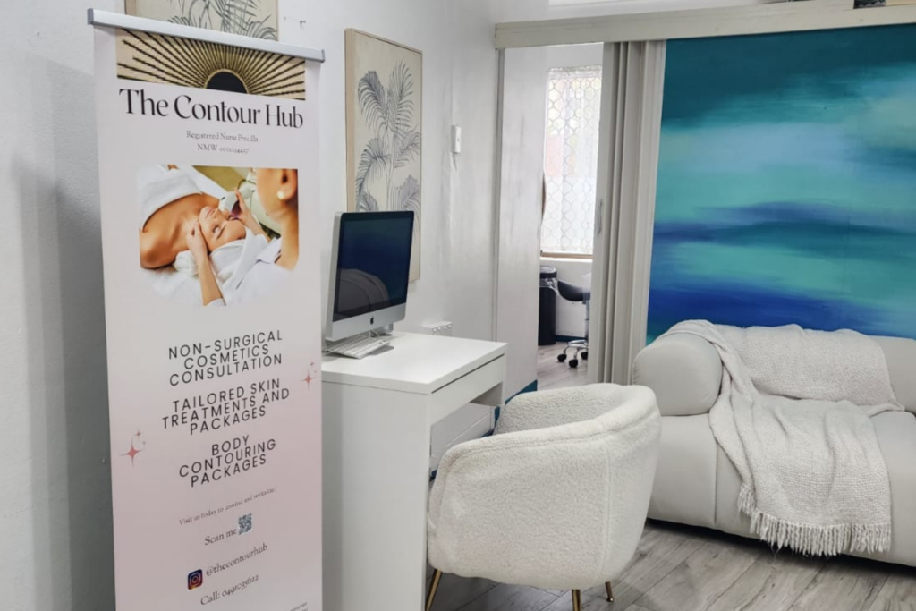 The Contour Hub Advanced Skin and Aesthetic Clinic private consultation desk and plush white chair.